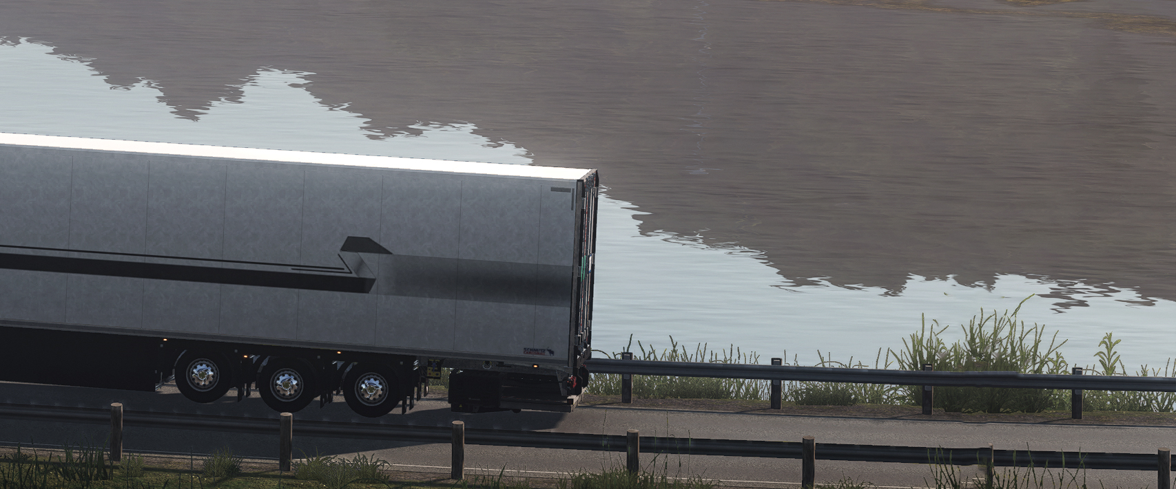 A ThermoExpress trailer following a quiet river bend